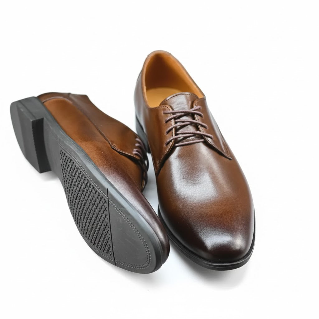 Close-up of premium hand-burnished Italian leather texture on Oxford shoes